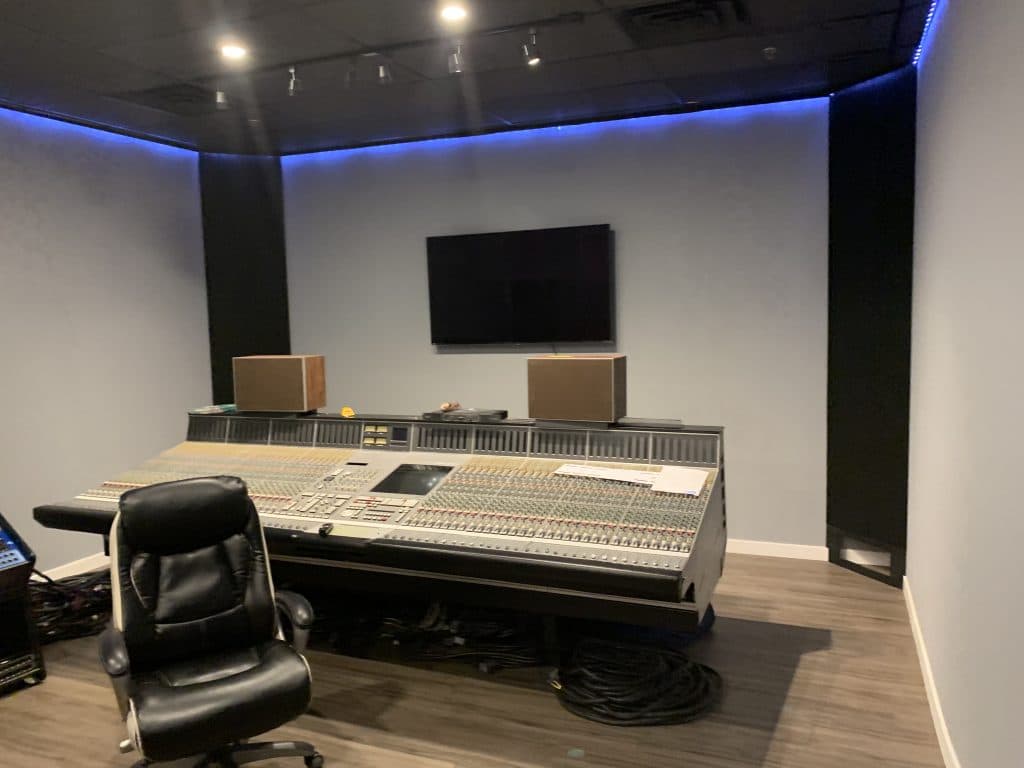 Empty recording studio with mixing console
