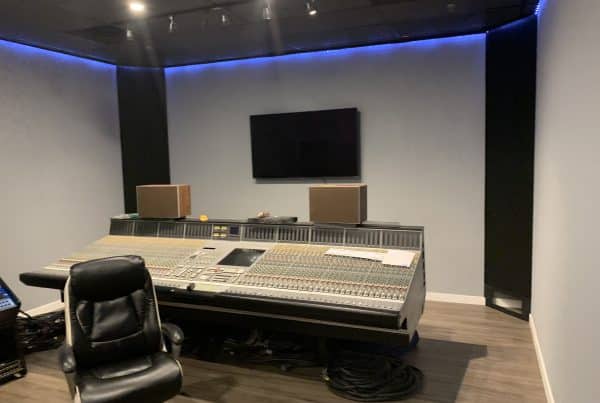 Empty recording studio with mixing console