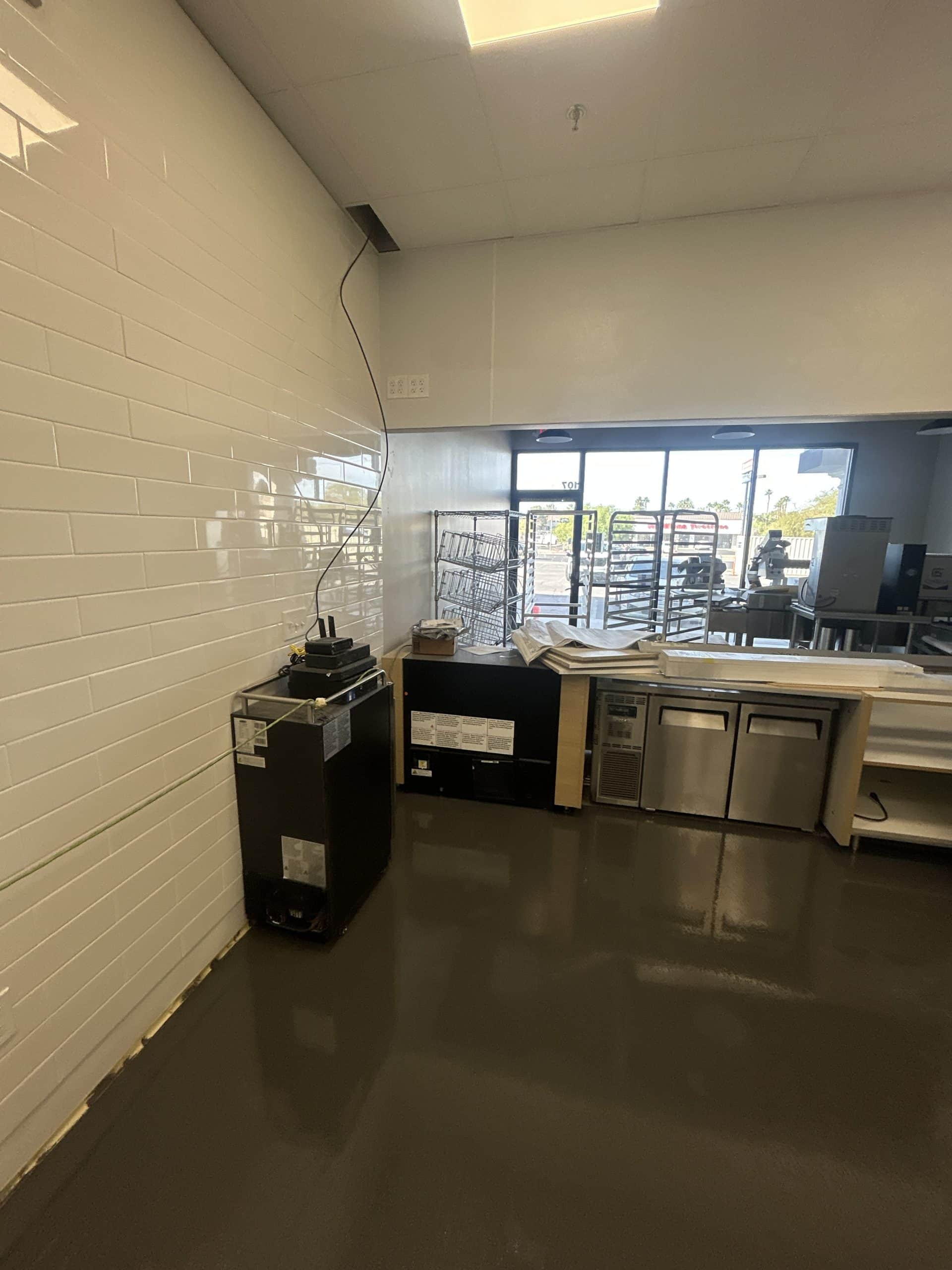 Empty commercial kitchen space with appliances