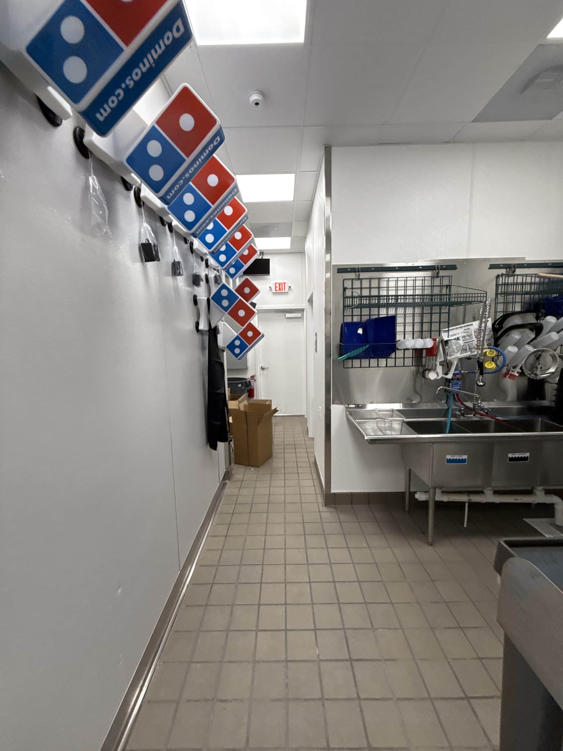 Clean kitchen corridor with equipment.