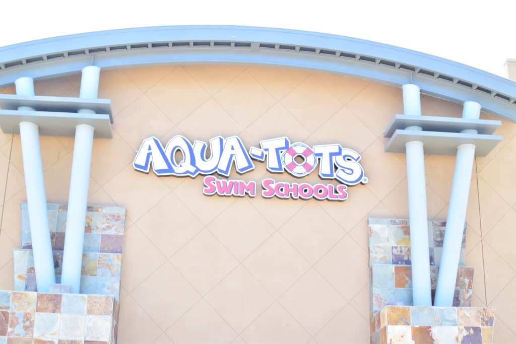 Aqua-Tots Swim Schools sign displayed