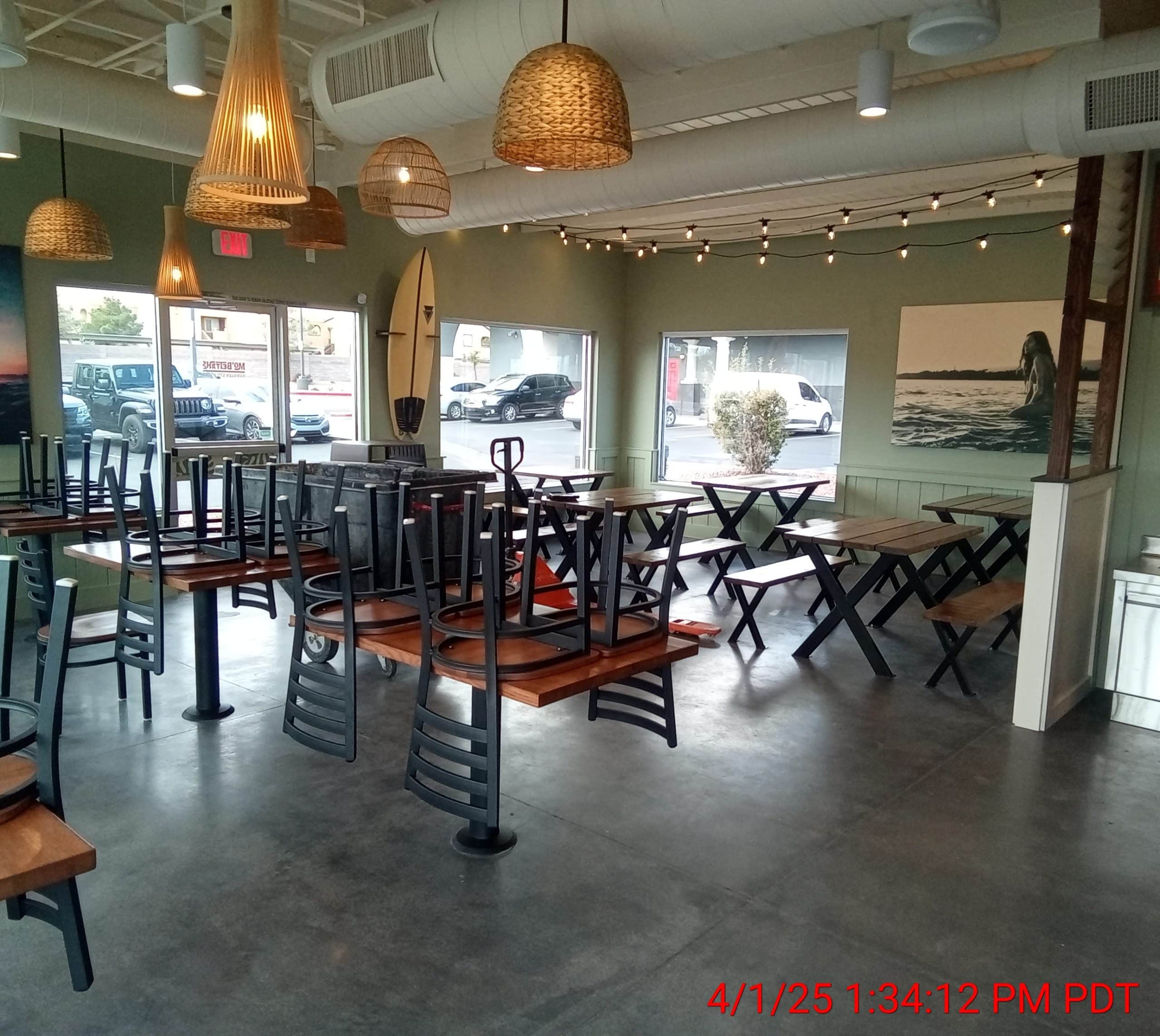 Empty restaurant with chairs stacked up.